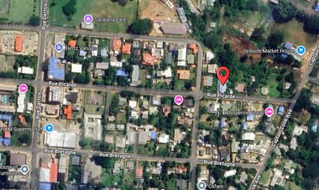 A satellite view of a residential area with marked locations and streets.