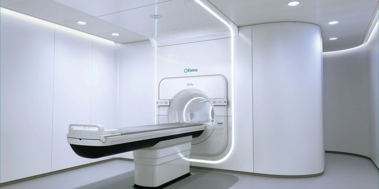 Modern MRI scanner in a clean, white room.