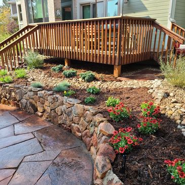 A great example of a balanced outdoor living space featuring hardscapes, xeriscaping, and softscapes.