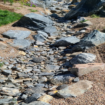 Most properties need clever drainage solutions after installing a hardscape or xeriscape