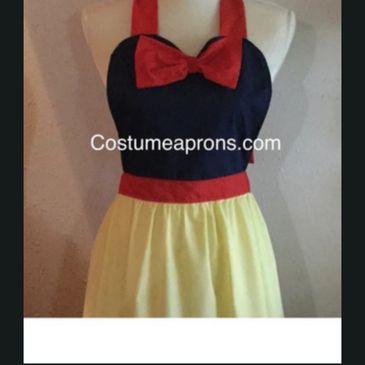 Snow White-inspired apron with red bow and yellow skirt.