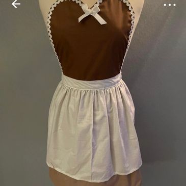 Vintage brown apron with white trim and bow accent.