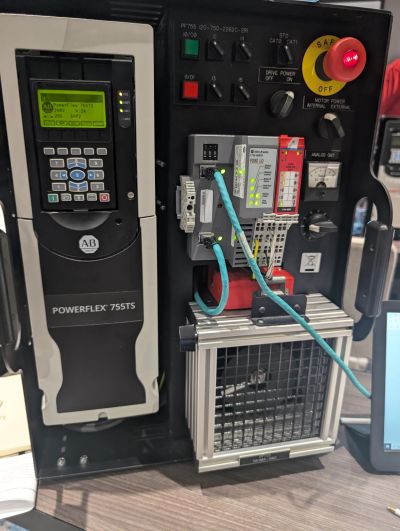 Industrial control panel with Allen-Bradley PowerFlex 755TS drive and connected components.