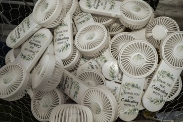 Custom white handheld fans with thank you message.