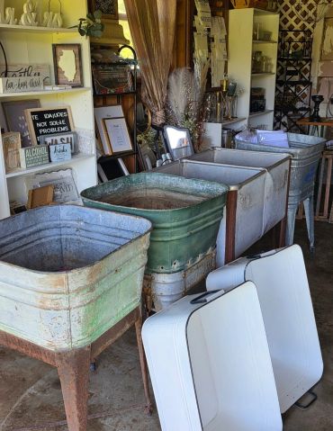 Rustic metal tubs inside a cozy shop.