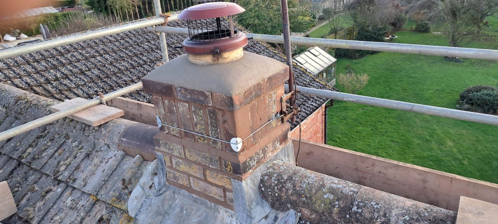 Chimney repointed with new cowl and haunching.