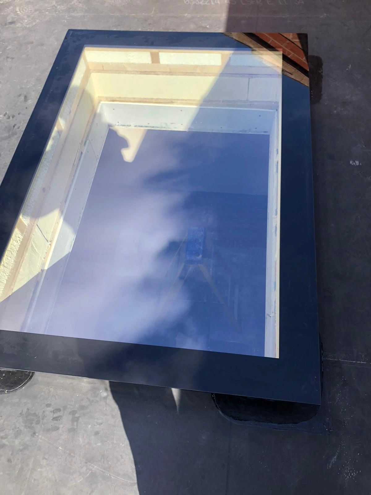 Flat roof window installed onto Firestone EPDM rubber roof.