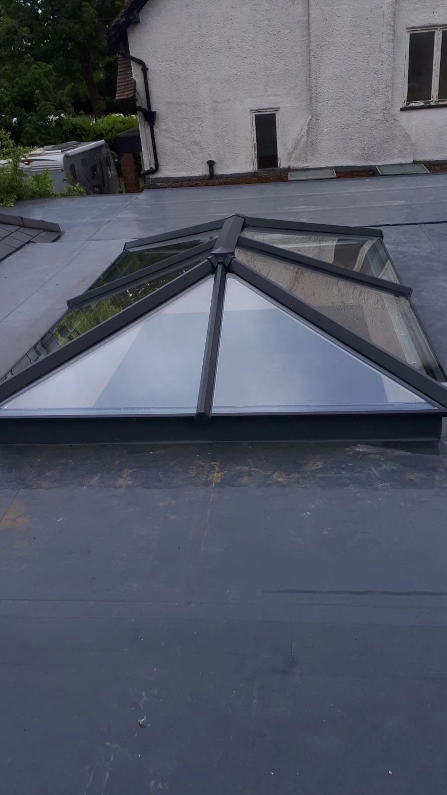 New Firestone EPDM rubber roof with anthracite roof lantern.