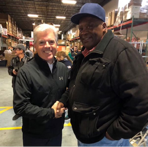 Suffolk County Executive Steve Bellone and Pastor Jerome Lewis 