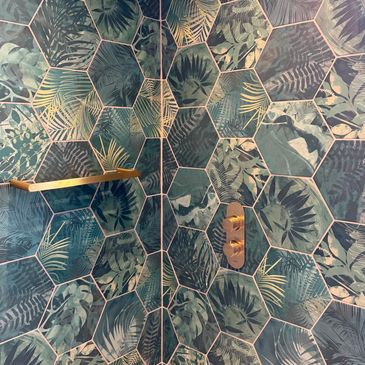 Hexagonal tropical leaf patterned wall tiles.