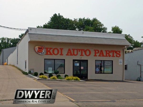 KOI Auto Parts storefront with parking lot.