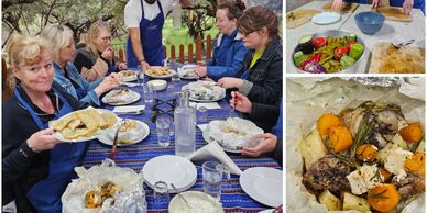 Group enjoying a homemade meal outdoors with various dishes served on a blue tablecloth.