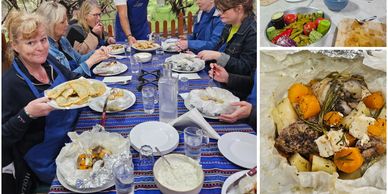Group cooking class enjoying homemade dishes and outdoor oven cooking.