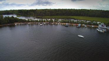 Drone view of Scotty's Beach with boats, Lake of the Woods, Kenora.
