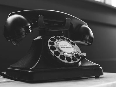 Black old fashioned telephone .           Homemoveassist.com