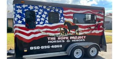 Patriotic trailer for The Hope Project Horses &amp; Heroes with American flag and horse graphics.