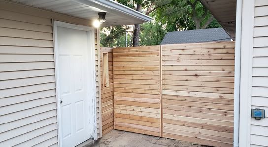 New Cedar privacy fence and gate to the backyard