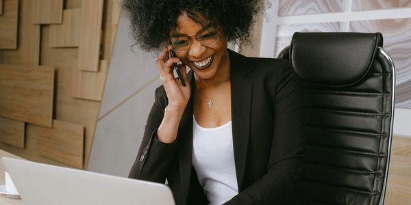 Woman on phone and computer