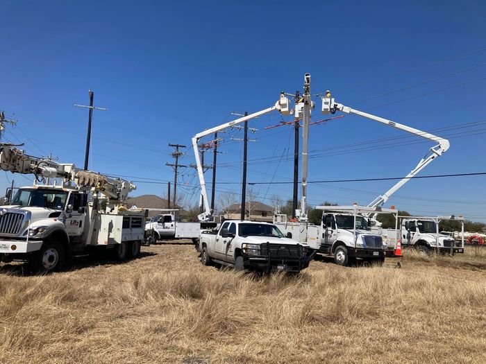 Group of trucks working on a power line