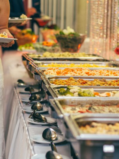 Buffet setup with various dishes in serving trays.