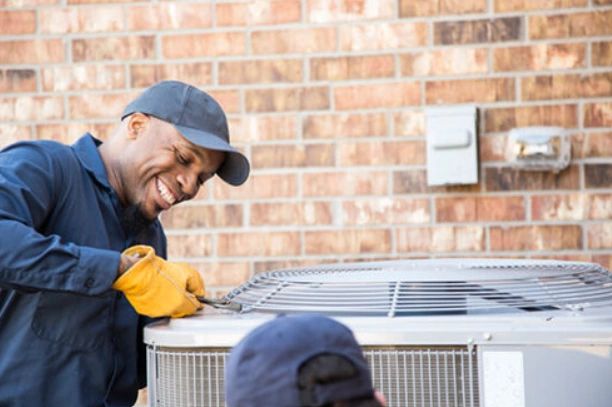 Mac Heating and Air Technician Performing Spring AC Maintenance and AC Repairs