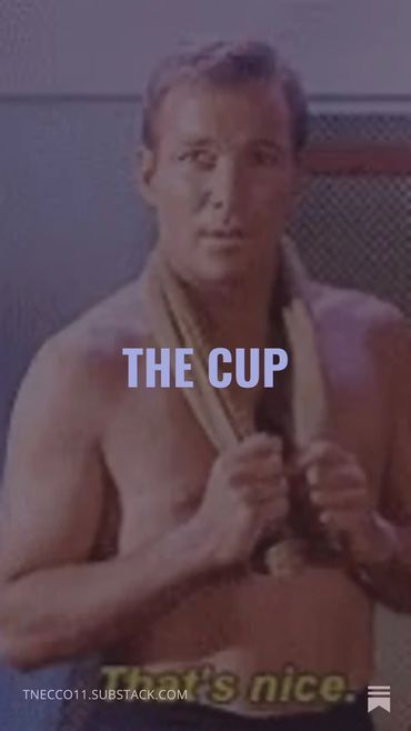 Man with towel around neck and text "THE CUP" overlay.