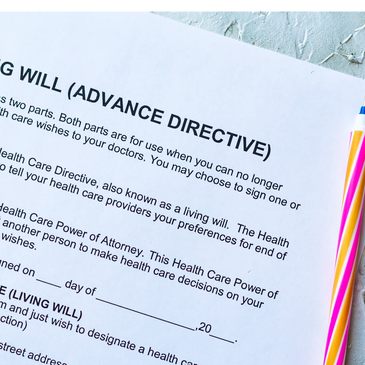 A living will (advance directive) form with a colorful pen on a textured surface.