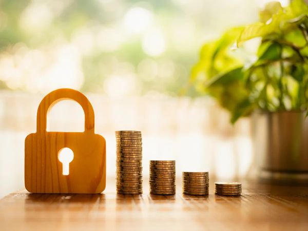 Wooden lock with stacks of coins in ascending order.