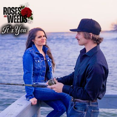 Couple fishing by the water, titled 'Roses and Weeds - It's You'.