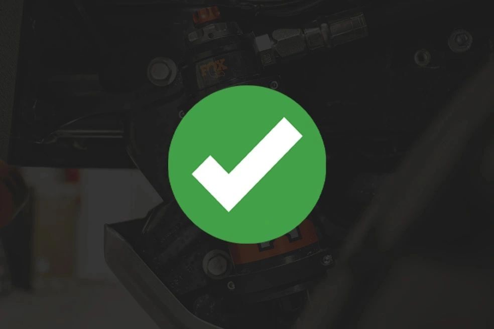 Green checkmark symbol on a dark background.