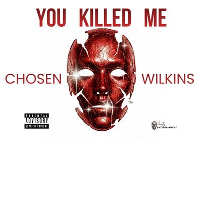Album cover featuring a cracked red mask and bold text.