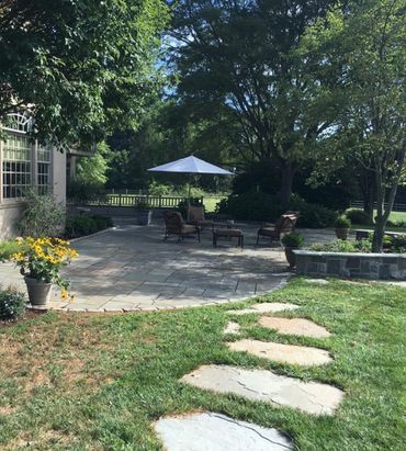 Backyard patio with natural rock path in Ann Arbor Michigan