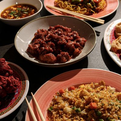 Hakka dishes and chop sticks on plates.