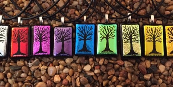 a necklace with different colored trees on it