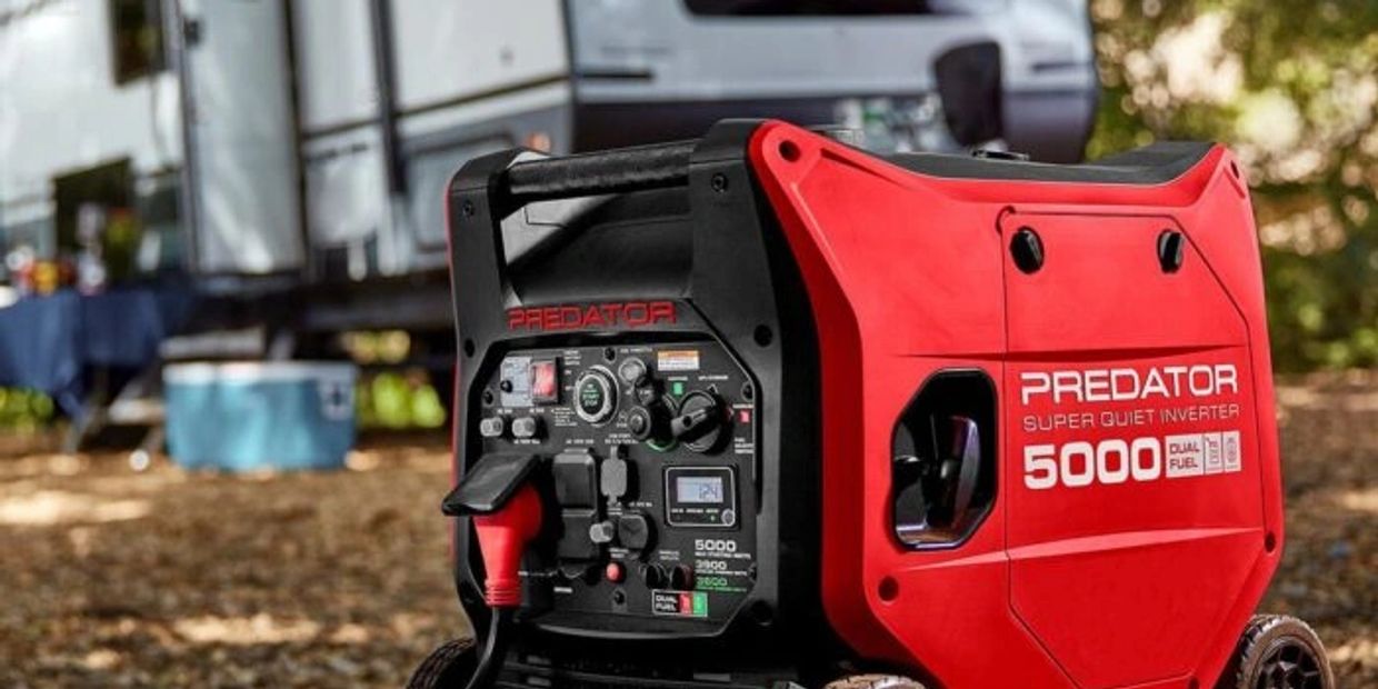 Portable red Predator 5000 watt generator outdoors.