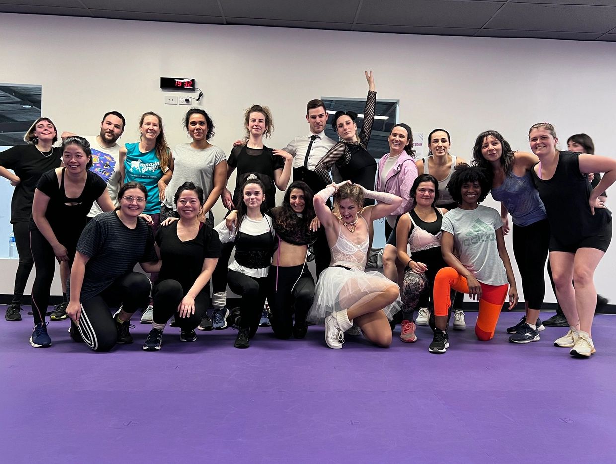 A Madonna Themed Aerobics Class with everyone dressed up in Madonna costumes