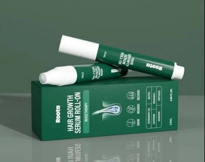 Rootd Hair Growth Serum Roll-On with green packaging and applicator.