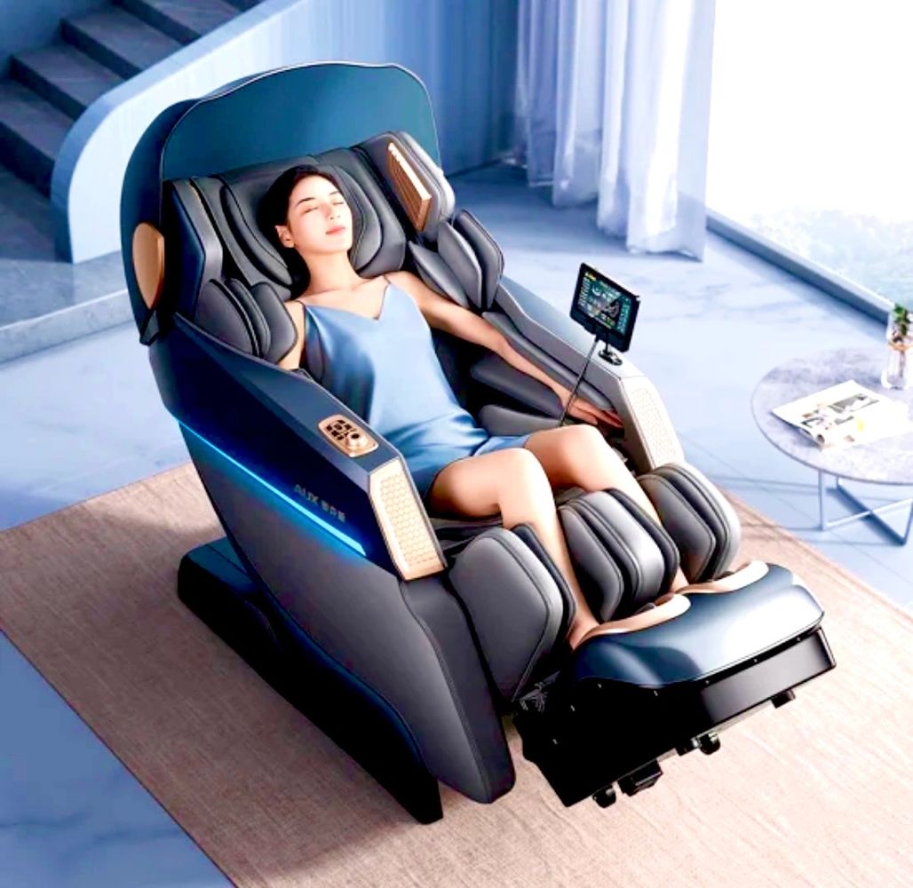 Woman relaxing in a high-tech massage chair with leg and arm cushions.