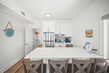 First floor wet bar kitchenette with dining island at Serenity Cove vacation home