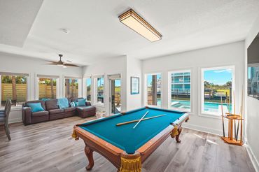 Billiards game room featuring a full-size pool table at Serenity Cove Perdido Key