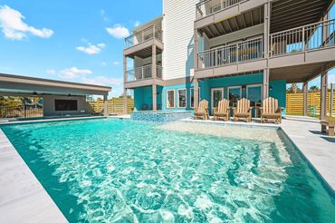 Spacious heated pool deck and hot tub spa at Serenity Cove luxury rental Perdido Key