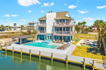 Angled aerial view of Serenity Cove property with private canal access in Perdido Key