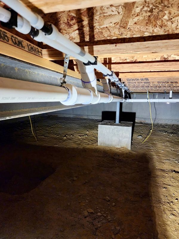 Installation of water lines and drains for residential new construction project.