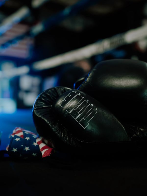 Black boxing gloves and an American flag cloth.
