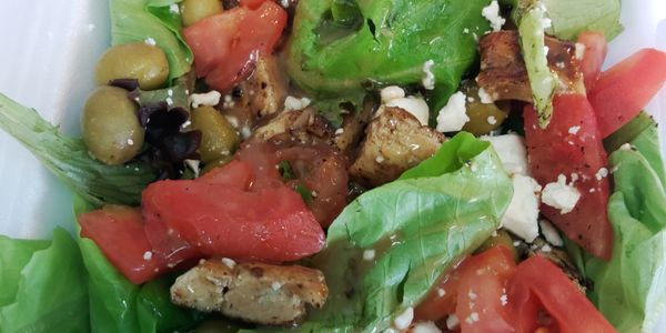 Grilled Chicken Spring mix salad with Feta Cheese, Olives, and Tomatoes