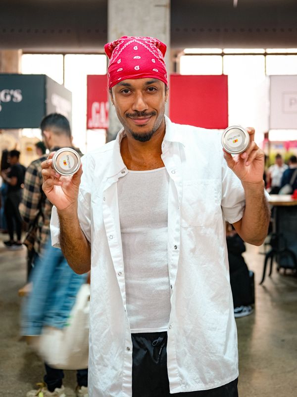 Co-Founder Ioan Delice with two jars of Pikliz Please