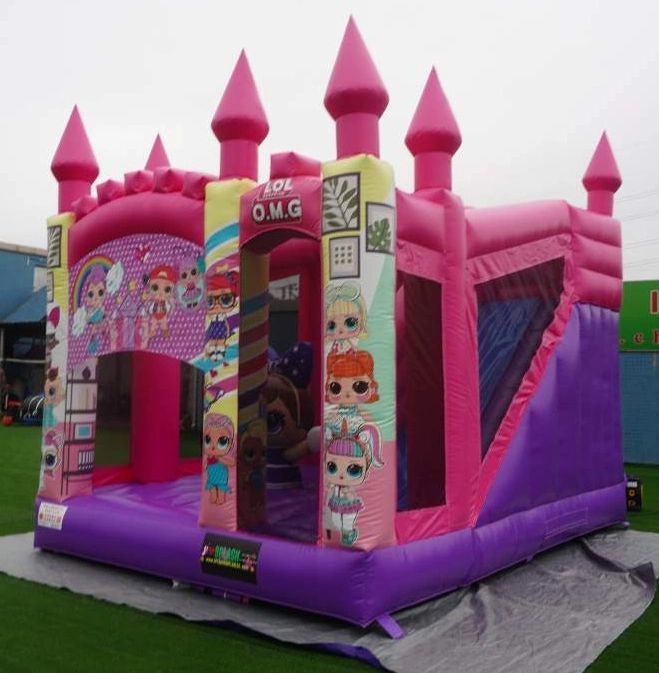 Pink and purple inflatable bounce house with cartoon characters and castle-like turrets.