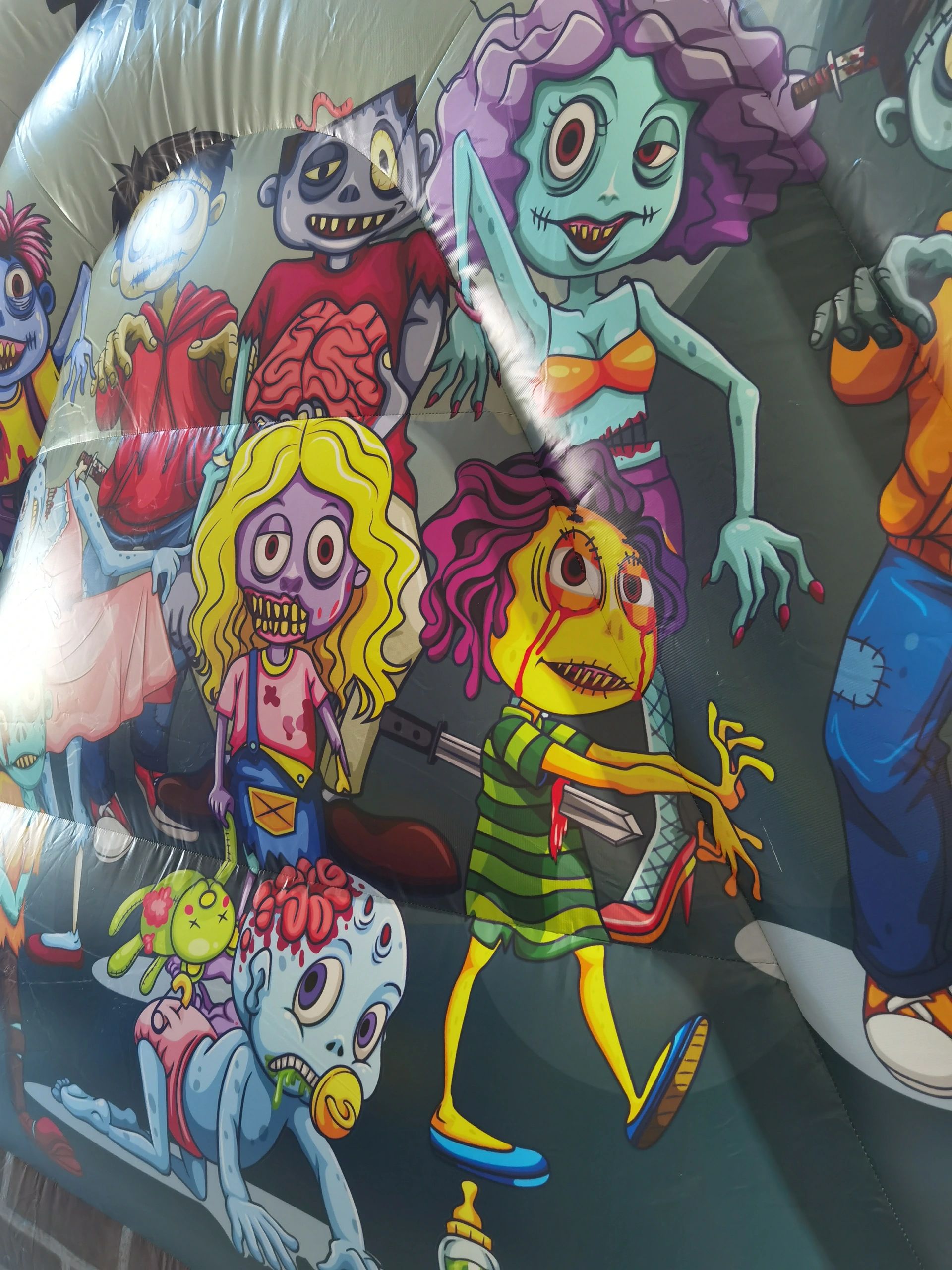 Colorful cartoon zombies with exaggerated features on an inflatable surface.