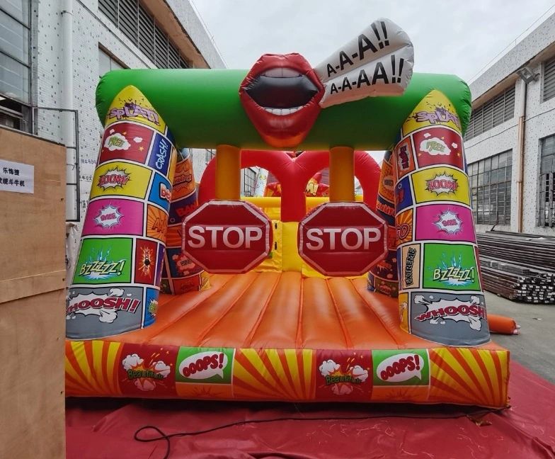 Colorful inflatable obstacle with comic-style designs and stop signs.