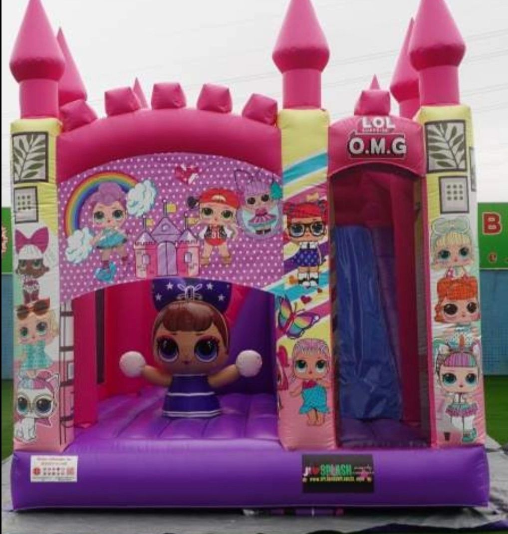 Pink inflatable castle with LOL Surprise doll designs and slide.